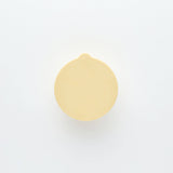 Round yellow object on a white background