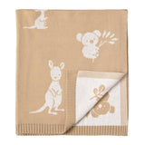 Beige baby blanket with white animal illustrations on a beige background
