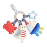 Colorful baby toy with a bird, crab, and star on a white background