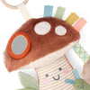 Plush toy with colorful tabs and a mirror on a white background