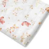Floral-patterned fabric with pink and orange flowers on a white background