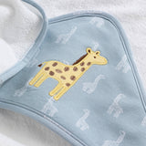 Blue towel with yellow giraffe design on a white background