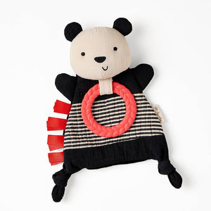 Panda-shaped toy with a red ring on a white background