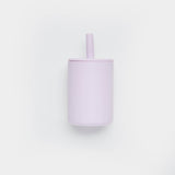 Purple tumbler with a straw on a white background
