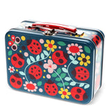 Colorful metal lunch box with ladybug and floral design on a white background