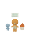 Set of baby-themed toys including a bear, a baby figure, and a cupcake on a white background.