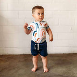 Snuggle Hunny Moonlight organic cotton toddler shorts in deep blue, Size 1, featuring a ribbed fabric and elasticated waistband.