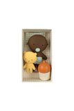 Three baby toys in a box on a white background