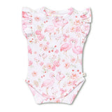 A baby bodysuit with a pink flamingo and floral print on a white background, featuring ruffled cap sleeves and a snap closure at the bottom.