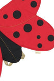 Red ladybug-shaped product with black spots on a white background