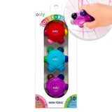 Ooly Color Busters non-toxic grip crayons in a 3-pack, shown in its retail packaging with a hand holding one of the crayons in an inset circle.
