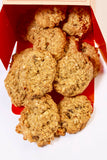 Oatmeal cookies in a red box on a white background