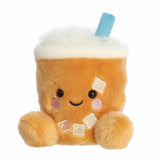 Plush toy resembling a cup of bubble tea with a smiling face on a white background