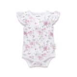 Floral-patterned baby bodysuit on a white background