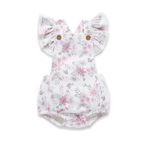 Floral baby romper with ruffled ears on a white background