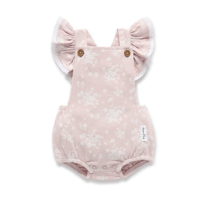 Pink baby romper with ruffled sleeves on a white background