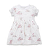 White dress with pink floral pattern on a white background