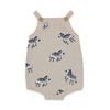 Knitted romper with zebra pattern on a white background