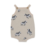 Knitted romper with zebra pattern on a white background