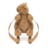Brown teddy bear with a backpack on a white background