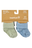 A 4-pack of Bearfoot ribbed top socks for babies, featuring one sage green sock and one dusty blue sock, displayed on a brown cardboard hanger against a white background.