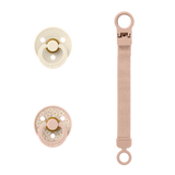 Two baby pacifiers with straps on a white background
