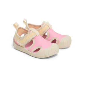 Pair of pink and beige children's sandals on a white background