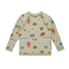 Children's long-sleeve shirt with colorful patterns on a beige background