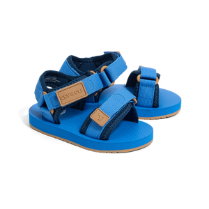 Blue children's sandals with brown straps on a white background