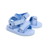 Pair of light blue sandals with multiple straps on a white background
