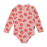 Pink children's onesie with strawberry pattern on a white background