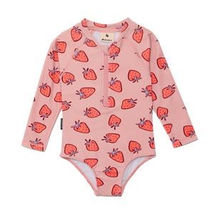 Pink children's swimsuit with strawberry pattern on a white background