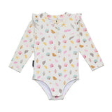 A baby long-sleeve bodysuit with a ruffled collar, featuring a colorful seashell and starfish pattern on a cream background, laid flat against a white background.