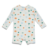 A long-sleeve baby romper with a tropical beach print on an off-white background, featuring palm trees, seashells, suns, and hibiscus flowers in green, orange, and light blue.