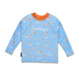 A light blue long-sleeve kids' rash guard with an orange collar, featuring a repeating pattern of orange and white fish, and the brand name 'CRY WOLF' printed across the chest.