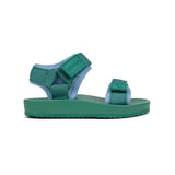A green children's sandal with light blue lining, featuring two adjustable straps and a thick sole, shown from a side profile on a white background.