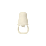 A cream-colored silicone baby teether or pacifier clip with a textured top and a loop handle, shown against a plain white background.