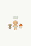 Set of baby-themed toys including a baby doll, teddy bear, and bottle on a white background