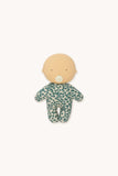 A small plush baby doll with a round beige head and a green-and-white spotted onesie, centered on a plain light background.