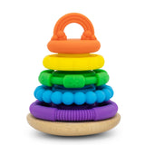 A colorful baby stacking toy with concentric rings in orange, yellow, green, blue, and purple, resting on a natural wood base against a white background.