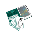 A children's educational drawing tablet and card game set on a white background. The teal-green tablet shows a world map on the screen and a colorful neon lion drawing, with a stylus resting on the right side.