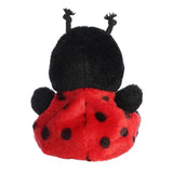 Plush ladybug toy with black and red colors on a white background