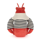 Plush toy lobster with red body, white and black striped shirt on a white background