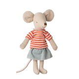Stuffed mouse toy wearing a striped shirt and skirt on a white background