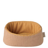 Pet bed with striped interior and beige exterior on a white background