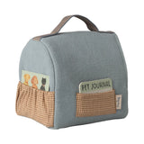Blue pet bag with brown pockets and 'Pet Journal' card on a white background