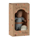 Stuffed rabbit toy in a cardboard box with 'Mailleg' branding on a white background