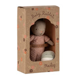 Stuffed rabbit toy in a cardboard box with 'Maileg' branding on a white background