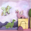 Toy dragons and blocks on a colorful background