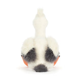 White plush toy with black spots on a white background